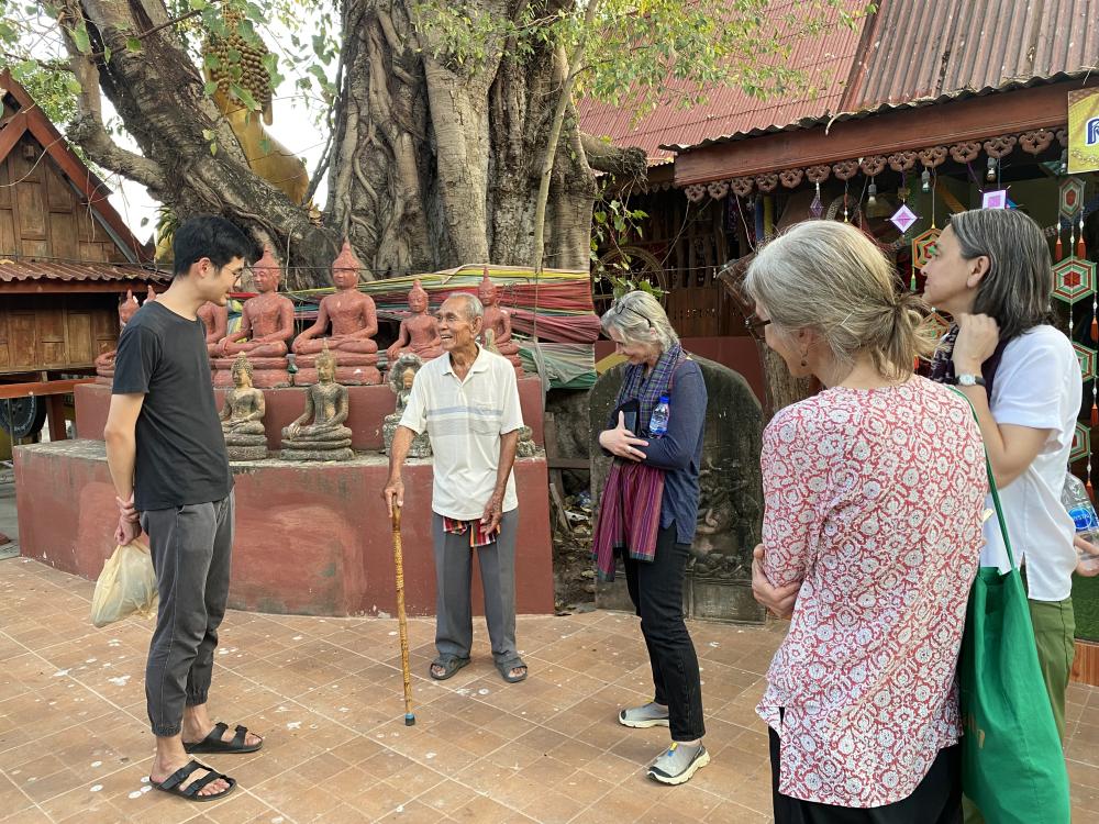 Speaking with a villager from nearby the ancient site of Muang Fa Daed. (Photo by Emma Efkeman)