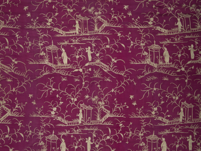 Dark pink fabric with silvery gold embroidery