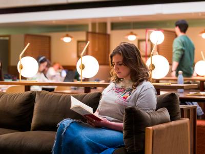 student is reading a book 