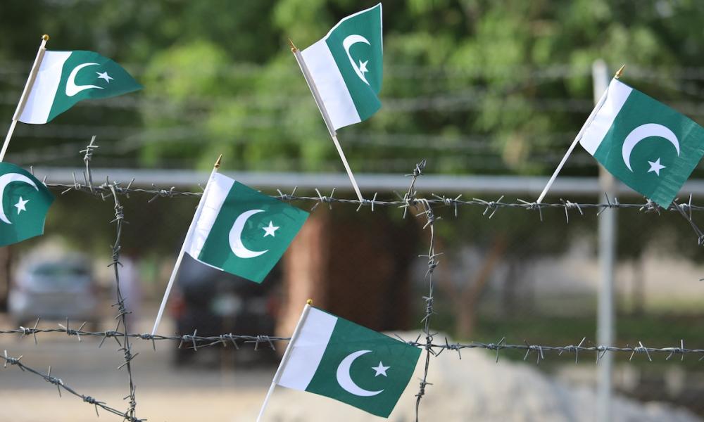 Pakistan flags on wire fence