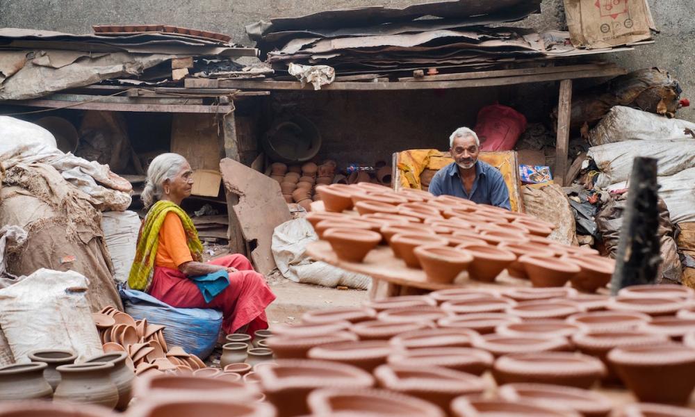 Elderly woman and man in India working