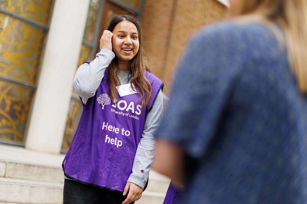 Student ambassador talking to student on open day