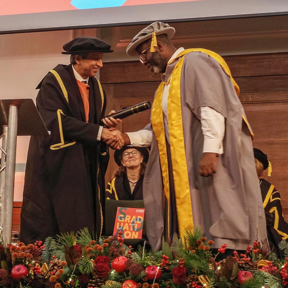 Misan Harriman receives his Honorary Fellowship from SOAS Director Adam Habib