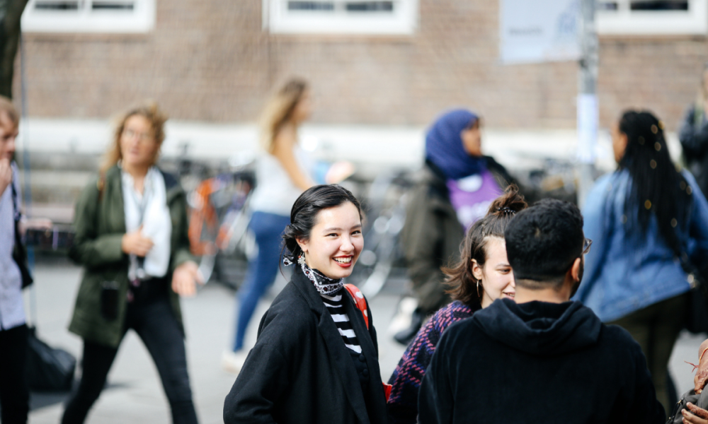 student smiling on campus