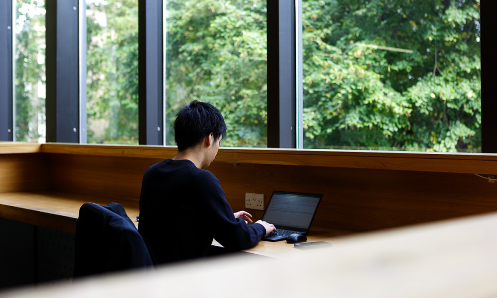 Man working on laptop in SOAS library