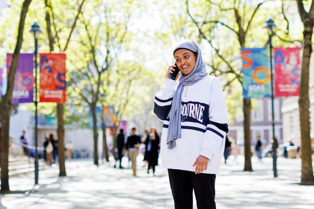 Student on phone on campus