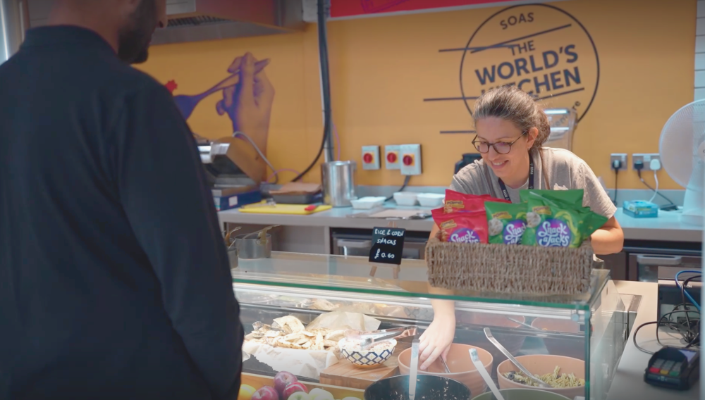 Serving food at the World's Kitchen on SOAS campus.