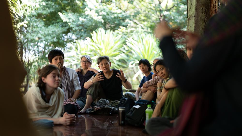 Dr Heidi Tan sharing in a group discussion during site visits. (Photo by Kanat Naktanomsub, courtesy of Getty)