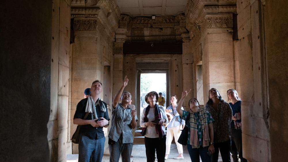Looking at a lintel in the central shrine at Phimai. (Photo by Kanat Naktanomsub, courtesy of Getty)