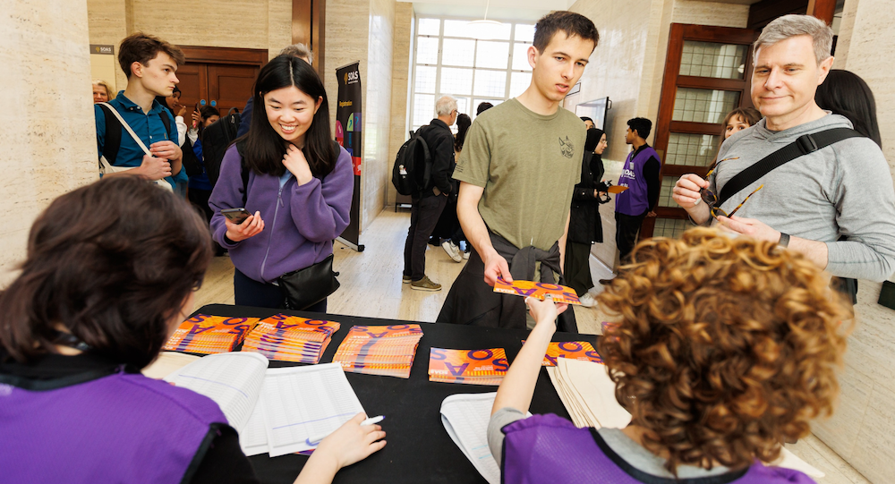 Visitors register for the open day 