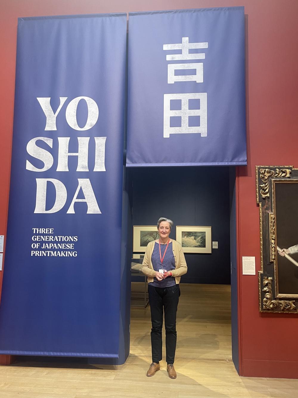 Dr Monika Hinkel at the entrance to the Yoshida exhibition