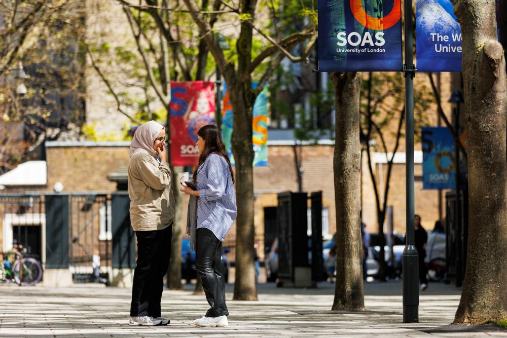 Students chatting outside on precinct