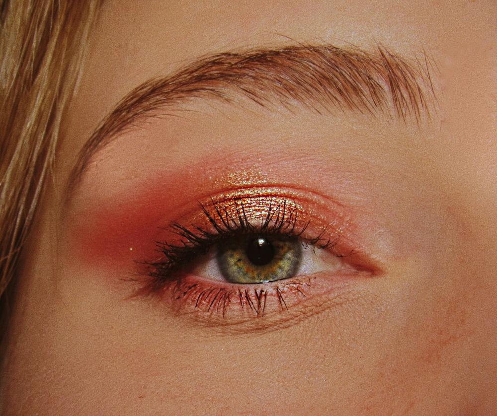 A close up of a woman's eye with make up on 
