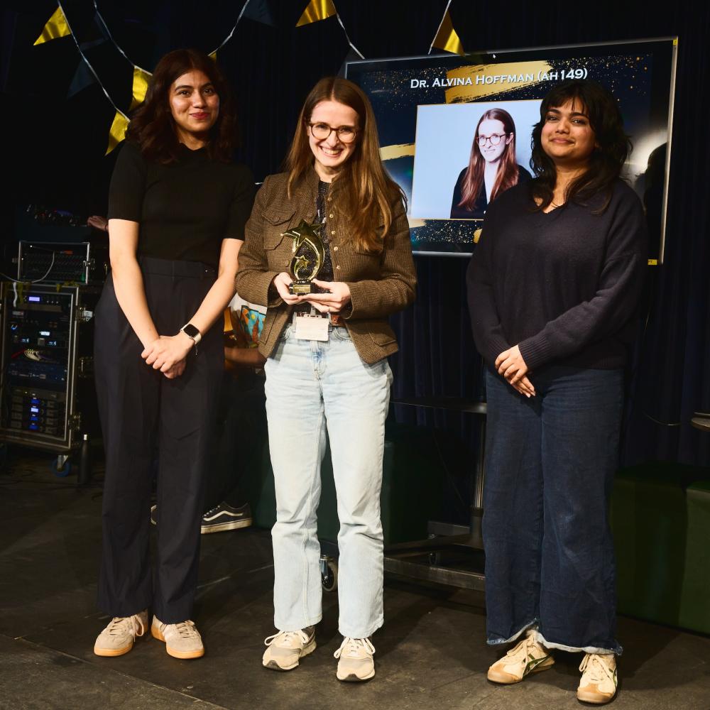 Dr Alvina Hoffman holding award