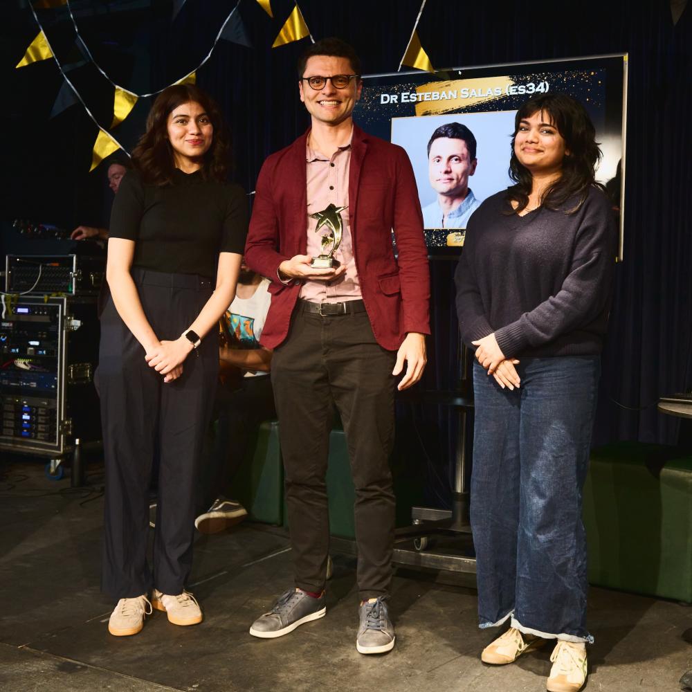 Dr Esteban Salas holding award
