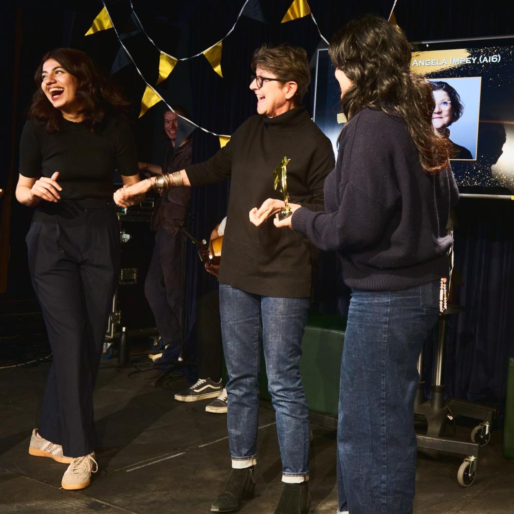 Professor Angela Impey with award