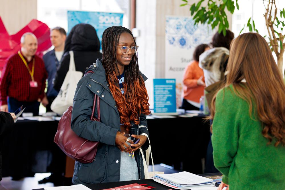 Student talking to a SOAS staff member at Open Day. 
