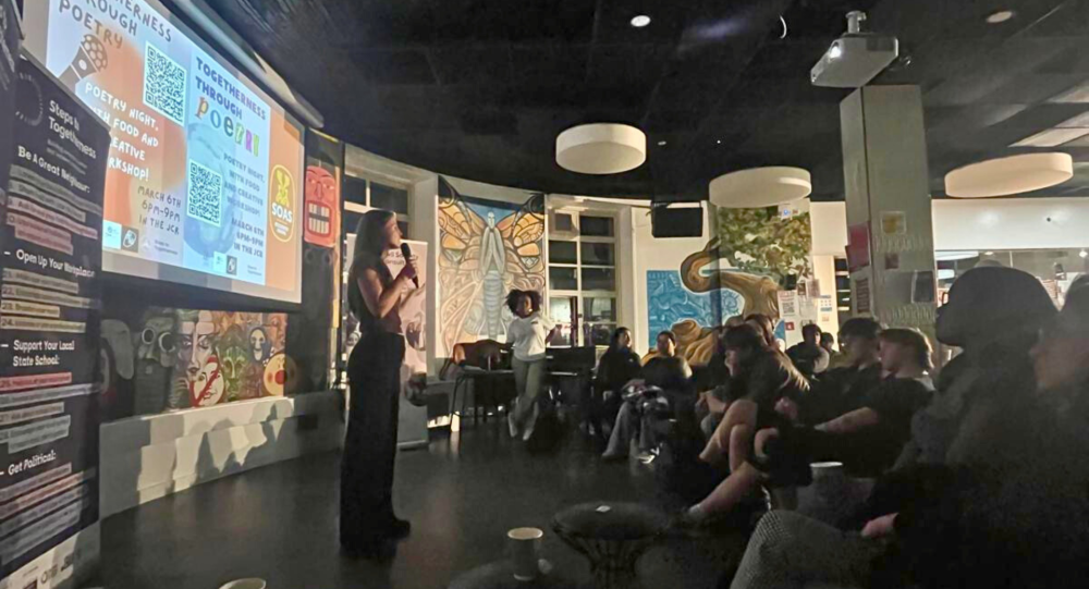 A group of students watch a presentation in the Students' Union