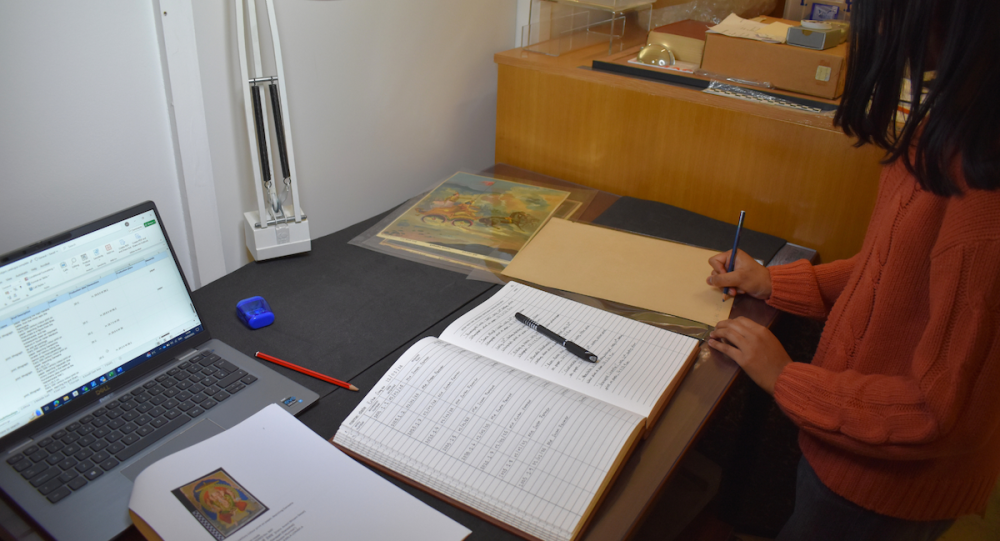 A student documents objects at the SOAS Gallery