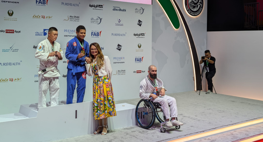 Ali on stage at the World Para Jiu Jitsu Podium