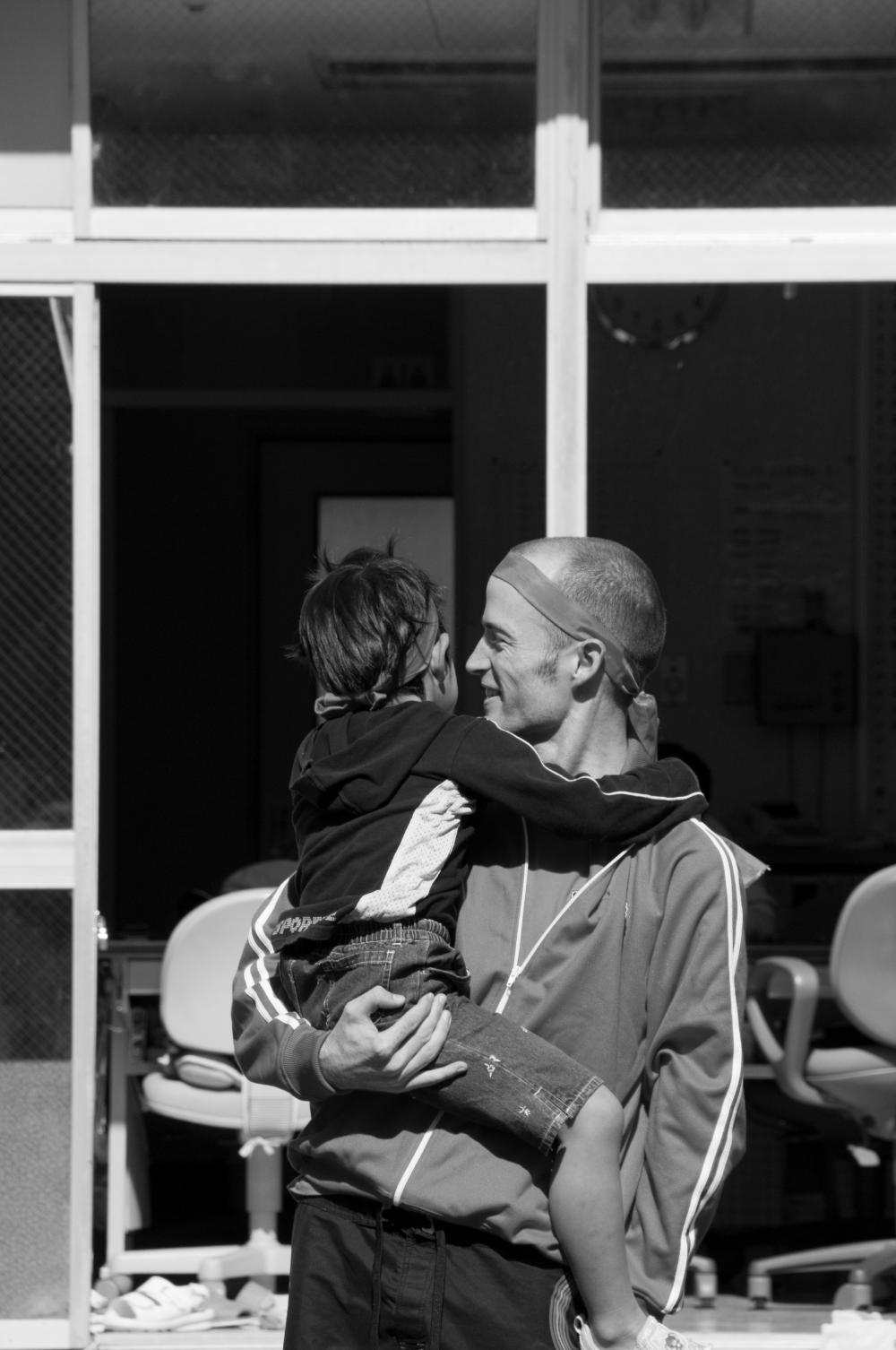 Why does Japan still use orphanage-style care rather than foster care and adoption?