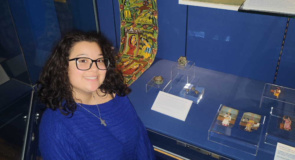 Xochitl Tai-Dawson in front of a blue museum display