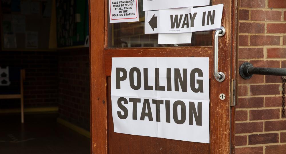 A sign for a polling station.