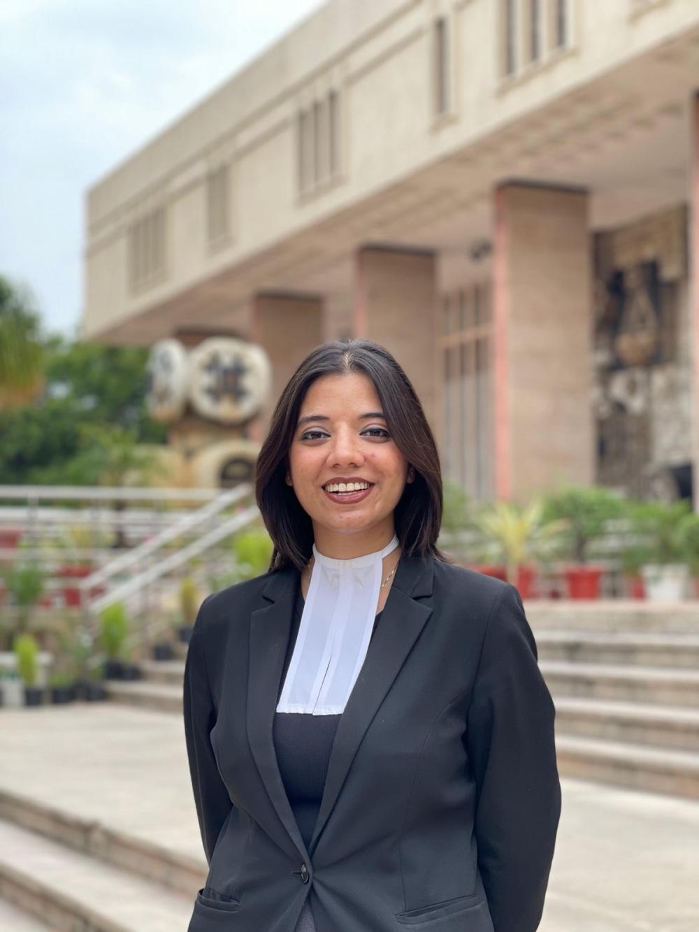 Young woman with dark hair in Indian lawyer uniform